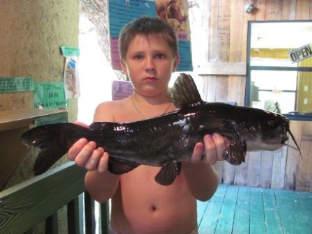 13 Year Old Boy with Large Catfish