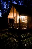 Log cabin at night