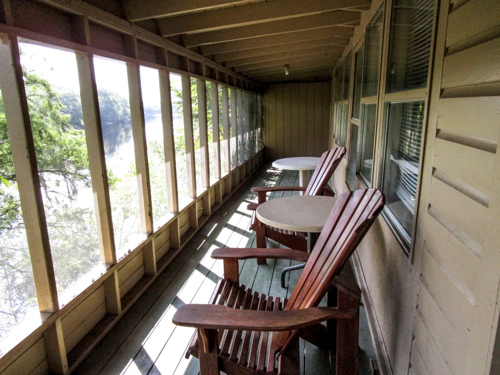 Two Adirondack Chairs on Covered Porch