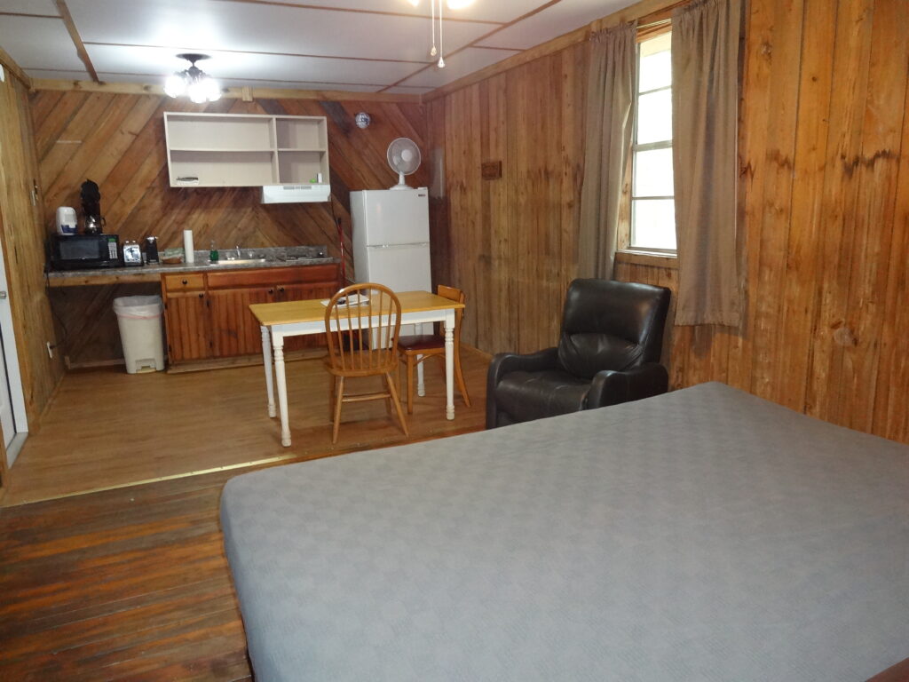 Bed. Chair & Kitchen inside Spring House